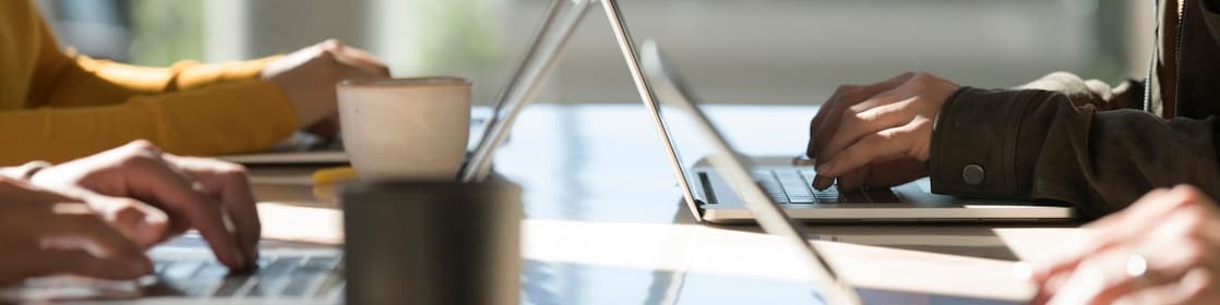 workers seen using laptops