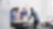 4 employees standing around a table in an office room discussing a project