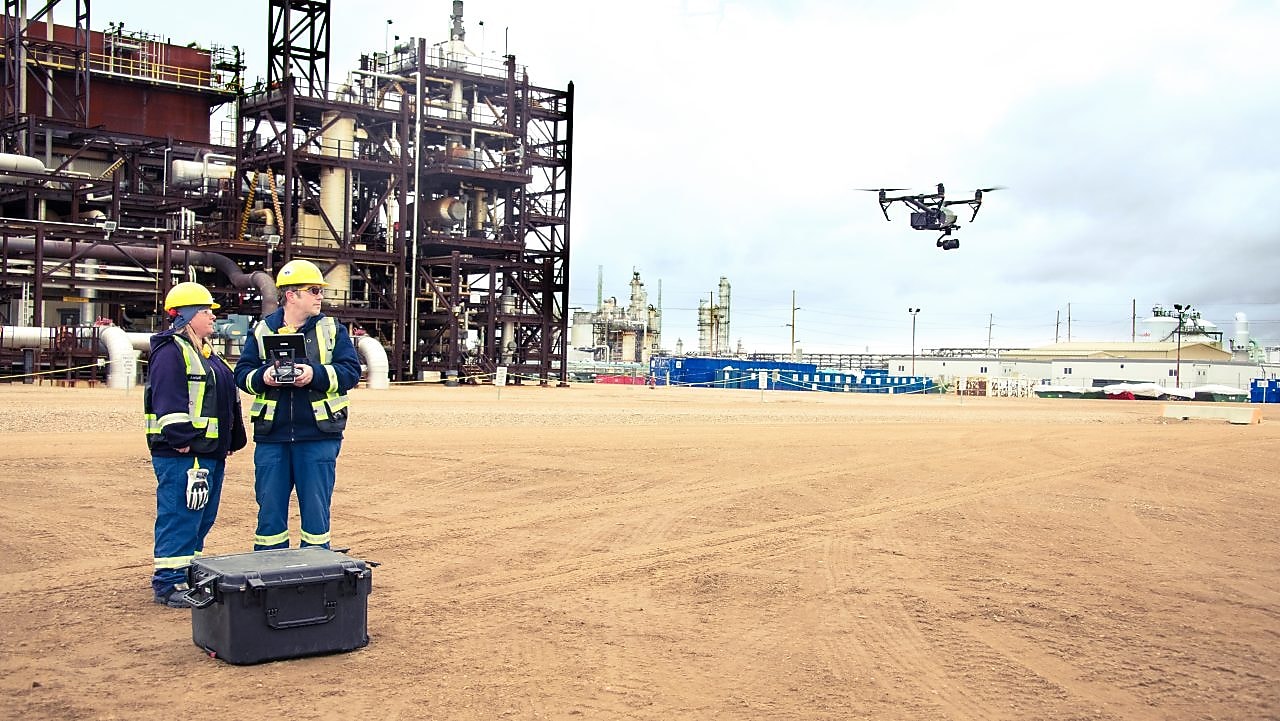 Engineers using drone for their work.