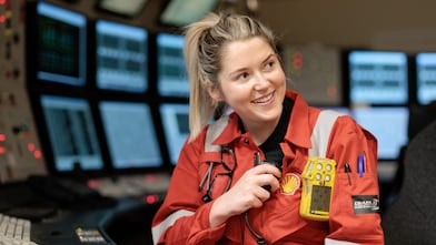 Girl showing Shell brand logo
