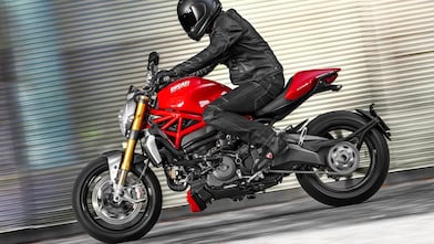 Man driving a Ducati motorcycle