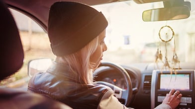 Woman in car with gps