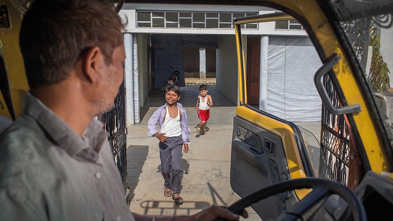 Indian children and truck driver