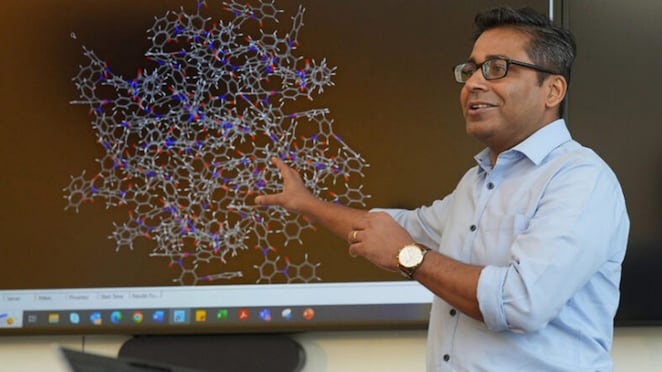 Nishant Sinha, a member of Suchi's team, reviews a molecular model at Shell Technology Centre Bangalore.