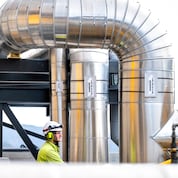 A worker at the Heidelberg Materials' cement plant. (Credit: Heidelberg Materials/Dag Jenssen)
