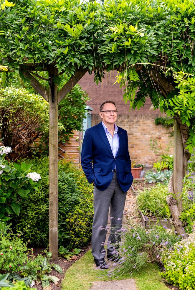 Sir Andrew in the garden of his home in London.