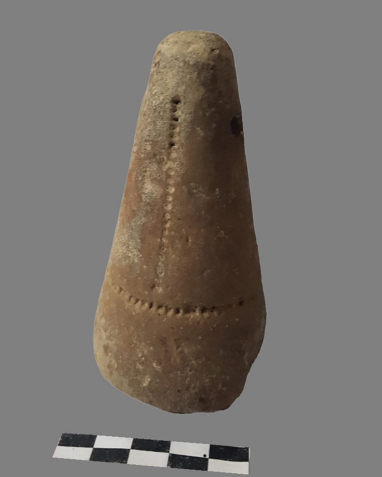 A loom weight, one of the artefacts found during the excavation.