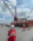 Project leader Norizah Othman stands in front of the barge that installed Timi 200 km off the coast of Sarawak, Malaysia.