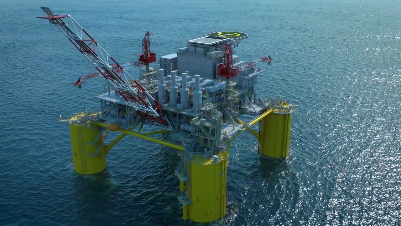Digital visualisation of the Sparta offshore oil and gas platform showing a large floating structure at sea supported by four yellow columns, with cranes, processing equipment, and a helipad on the top deck, surrounded by open water.