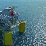 Digital visualisation of the Sparta offshore oil and gas platform showing a large floating structure at sea supported by four yellow columns, with cranes, processing equipment, and a helipad on the top deck, surrounded by open water.