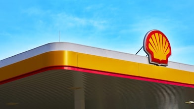 Close view of a Shell retail forecourt canopy with Pecten.