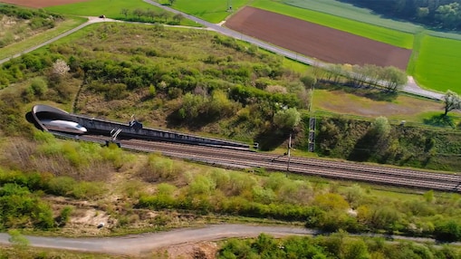 train pulling out of tunnel