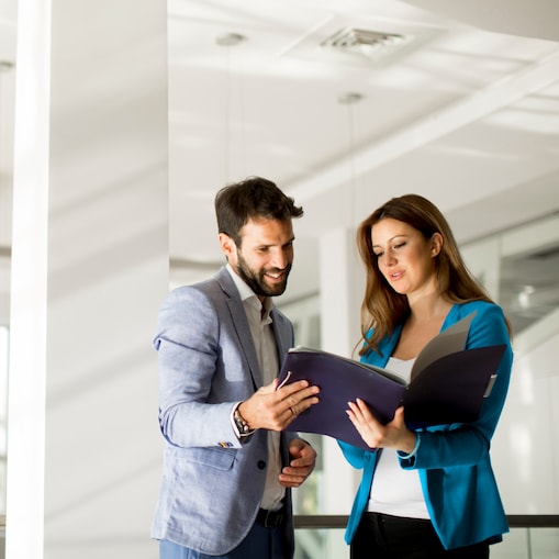 Man and women having discussion in a modern office