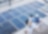 Engineering designers next to solar panels