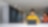 Lady wearling yellow jumper in busy office