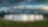 A digital rendering of a battery energy storage system featuring multiple white, container-like units arranged on a concrete pad in a grassy field.