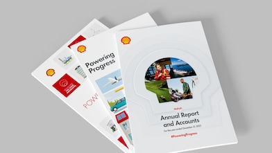 Image shows three printed Shell annual report publications fanning out laid one on top of the other 