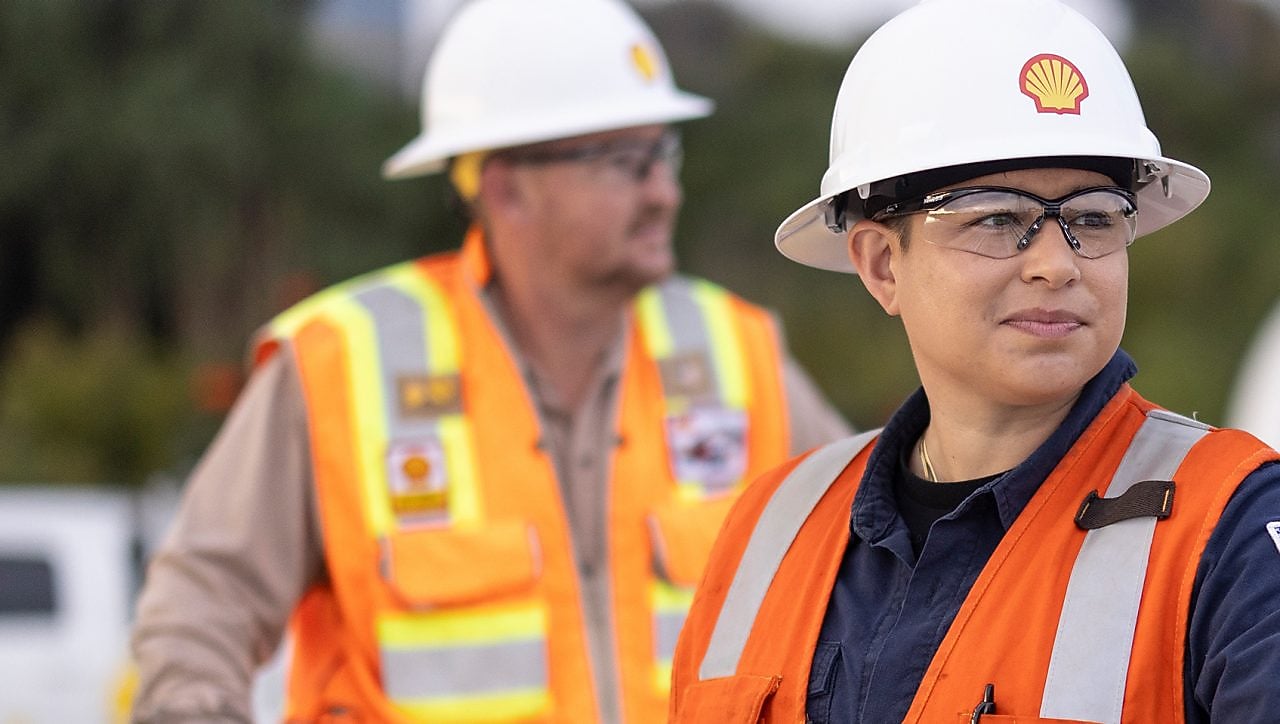 Two women checking the device on site