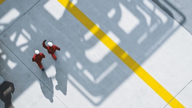 Two people walking in site