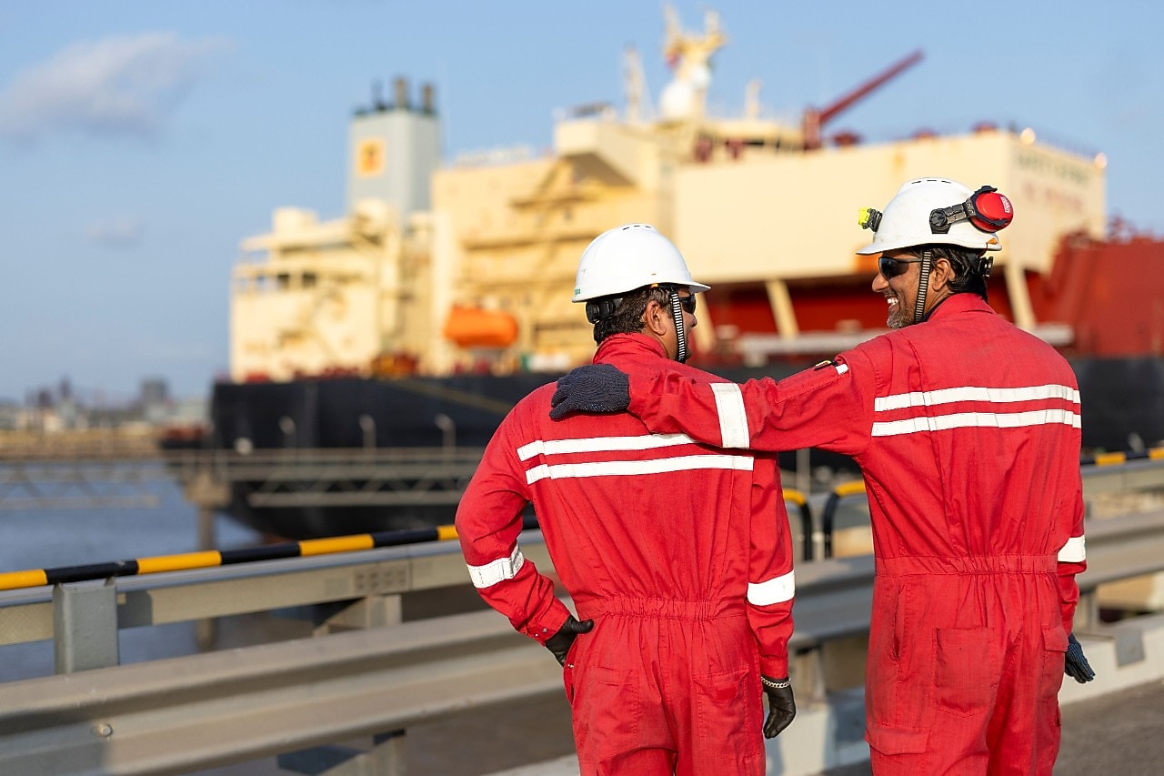 Two People operating tug boat