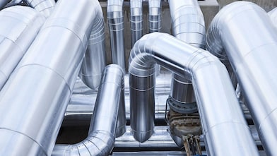 Close-up of metallic piping and ductwork for industrial gas handling.