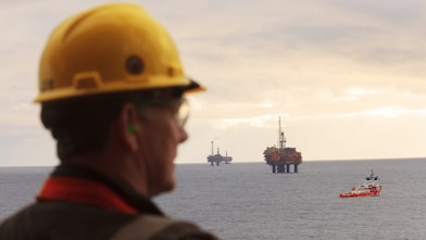 North Sea offshore platform, off the coast of Aberdeen, Scotland, 2014. Brent Delta Platform Brent Charlie, Bravo & Alpha (nearest to farthest) with the standby vessel
