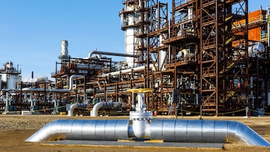 Image of the ceremonial valve used to mark the official launch of the Quest Carbon Capture and Storage (CCS) Project with the processing plant in the background
