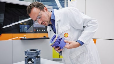 Engineer inspecting 3d printed replacement parts