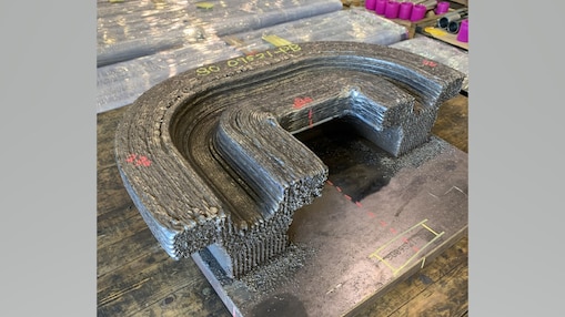 Clamp produced using Wire Arc Additive Manufacturing, as welding and prior to post-processing.