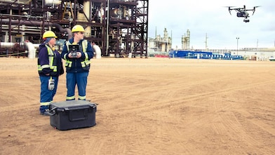 Engineers operating drone