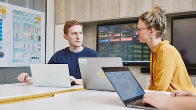 2 developers discussing blockchain in energy