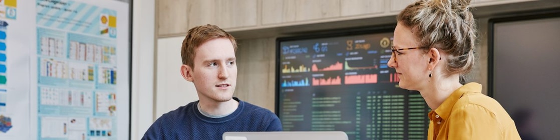 2 developers discussing blockchain in energy