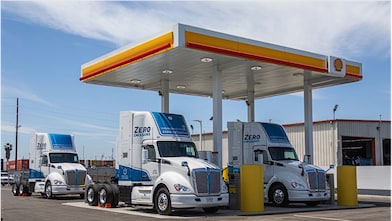 Hydrogen trucks parked at a Shell station