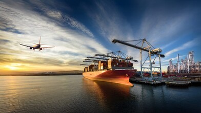 A composite image showing an airplane flying over water at sunset, a large cargo ship docked at a container port, and an industrial refinery complex on the right.