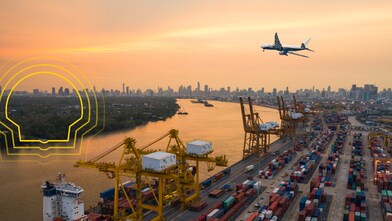 A plane flying over a port side