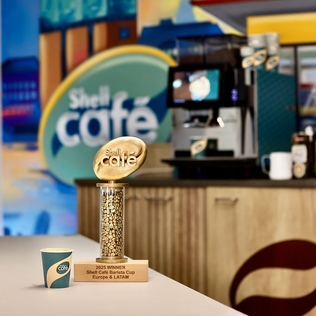 Shell Café Barista Cup 1st place trophy with coffee cup