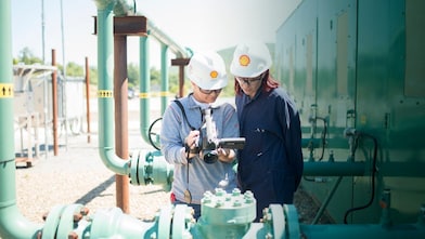 Two women testing Methane Emissions Leak Detection Stock