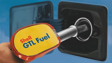 Person refuelling car with GTL fuel