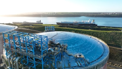 Picture of the LNG plant in Wales with the Shell LNG ship in the background