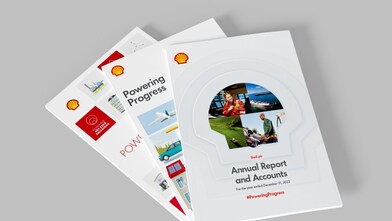 Image shows three printed Shell annual report publications fanning out laid one on top of the other