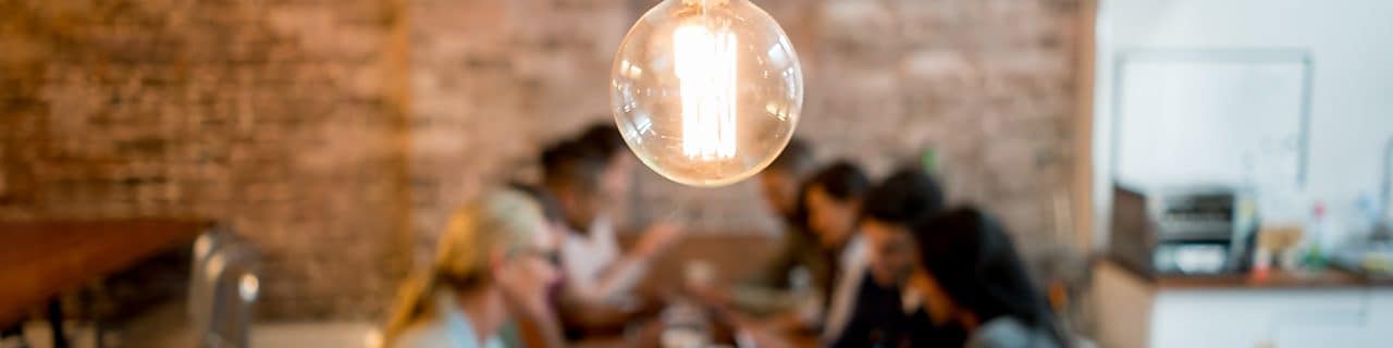 women-drawing-on-a-white-board