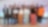 Thirteen people are posing for a group photo in front of a backdrop featuring the Shell logo and "Shell StartUp Engine" text.
