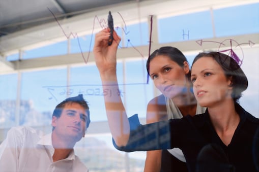 businesswoan writing report on glass