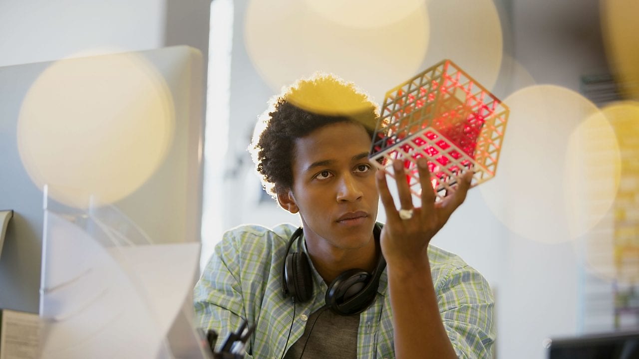 MIT boy holding cube