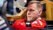BMW WEC driver Kevin Magnussen sat in his car ahead of the WEC Qatar 2025