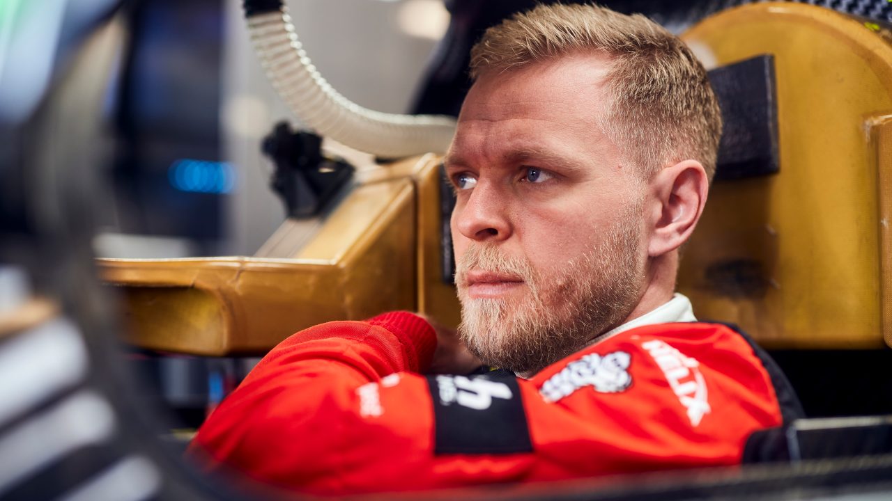 BMW WEC driver Kevin Magnussen sat in his car ahead of the WEC Qatar 2025