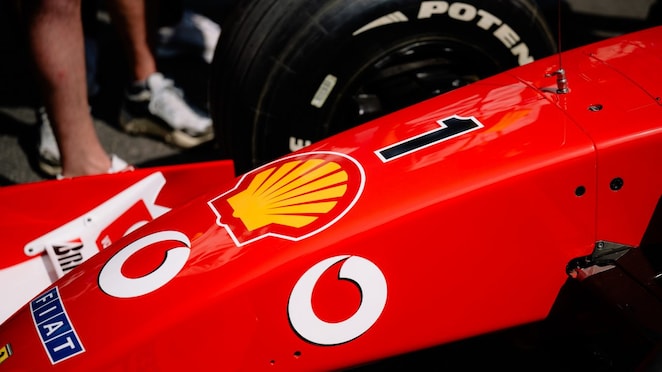 Close-up of the nose and bodywork of the Ferrari F2002 car, showing prominent sponsor branding and the number one.