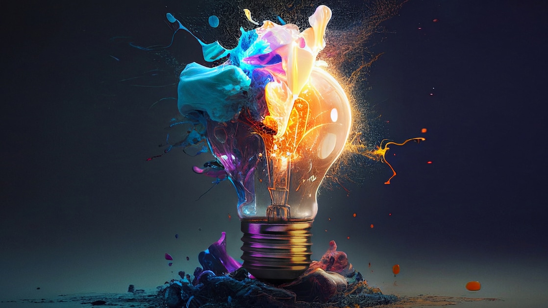 A colourful lightbulb expanding