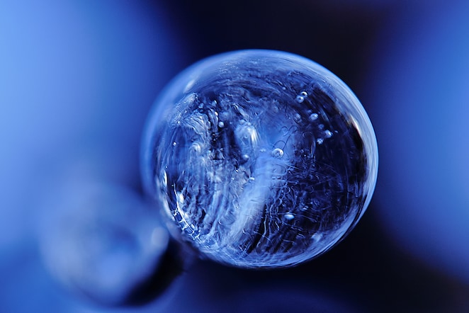 A glassy ball against a blue background (Photo: Francois Pelligrini)
