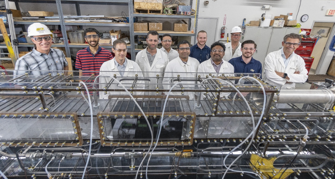 A group of people standing in a room at Shell TechWorks workshop